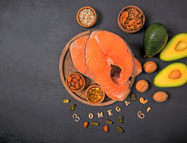 Omega-3 rich foods including salmon, avocado, nuts, and seeds for mental health